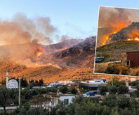 Marmaris'te taşlık ve makilik alanda çıkan yangın, tekne atölyelerini tehdit ediyor