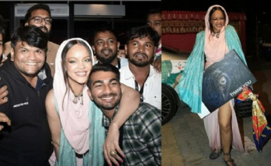 Rihanna konser çıkışı muhabirlerle fotoğraf çektirdi..